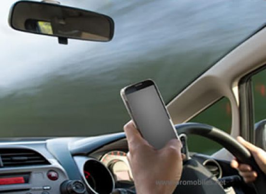 Should one drive using a mobile phone?