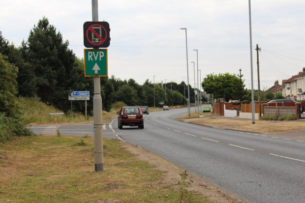 Catching motorists using mobile phones while driving